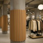 Czym zakryć betonowe słupy w sklepie?